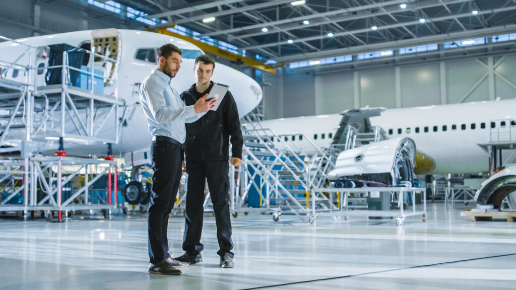 Aircraft Maintenance Worker and Engineer having Conversation Holding Tablet » The Military Connected Community Military Connected Community